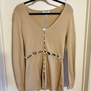 New & Other Stories tan cut out sweater with dainty pearl buttons.